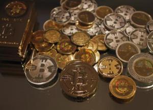 Some of Bitcoin enthusiast Mike Caldwell's coins are pictured at his office in Sandy, Utah